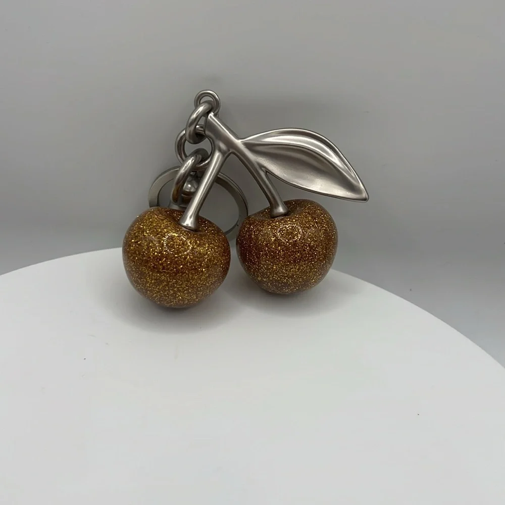 60. Gold Glittery‎ Cherry Keychain